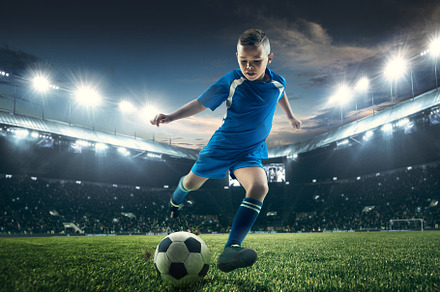 Young boy with soccer ball doing featuring soccer, boy, and football, a Sports & Recreation Photo by Volodymyr Melnyk