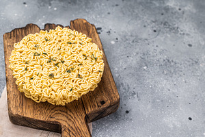 Twisted raw ramen noodles, ready to soak up flavors and bring wa, a Food & Drink Photo by composter-box@mail.ru