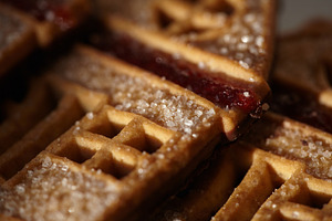 Sweet house-shaped cookies decorated with sugar and red fruit jam., a Food & Drink Photo by Rohan Photography