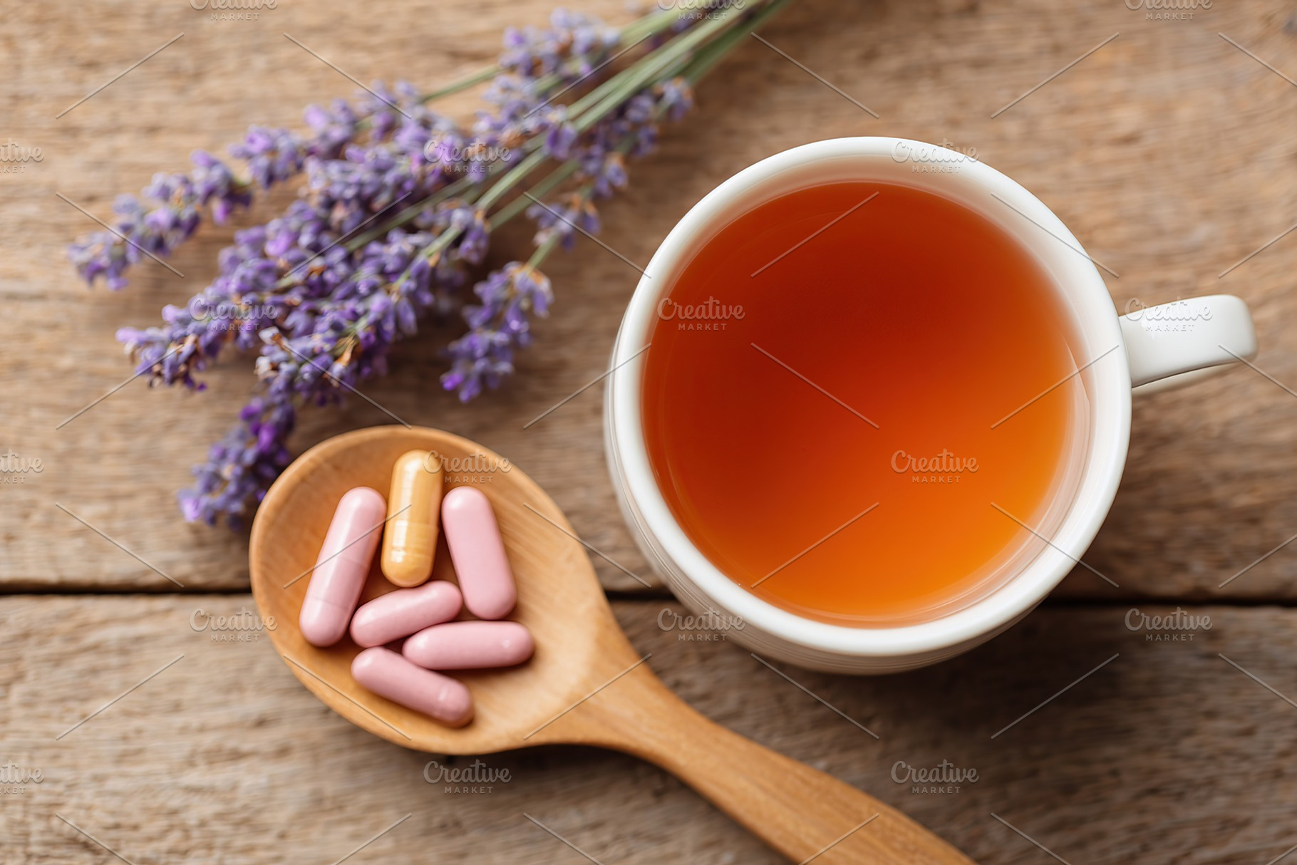 Fresh lavender herbal tea with pills on wooden table highlighting natural welln, a Food & Drink Photo by AlyaAnd