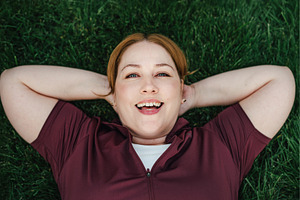 Beautiful plus size woman lying on, a Sports & Recreation Photo by HalfPoint