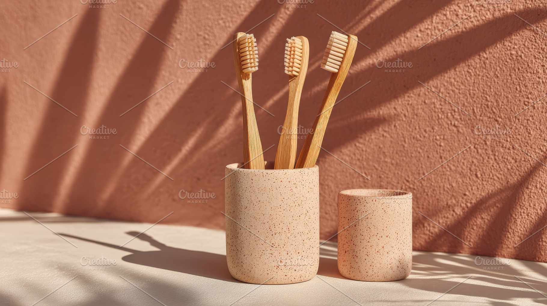 Bamboo toothbrushes in terracotta ho, a Photo by Pixeness Studio
