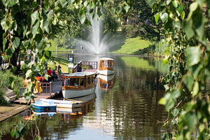 Wooden boat on canal in Riga, Latvia