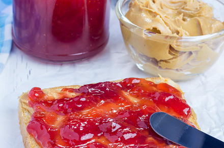 Sandwich with creamy peanut butter and strawberry jam, a Food & Drink Photo by iuliia_n