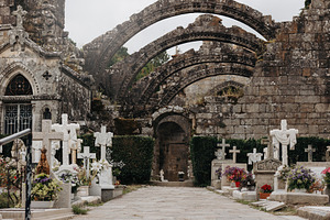 Ancient cemetery in front of medieva, an Architecture Photo by Perpis