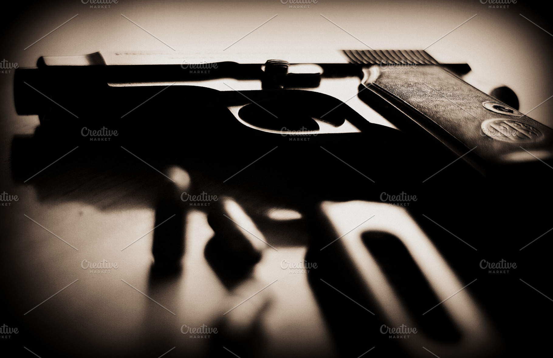 Gun, Bullet, and a Magazine, a Photo by PepPhelan