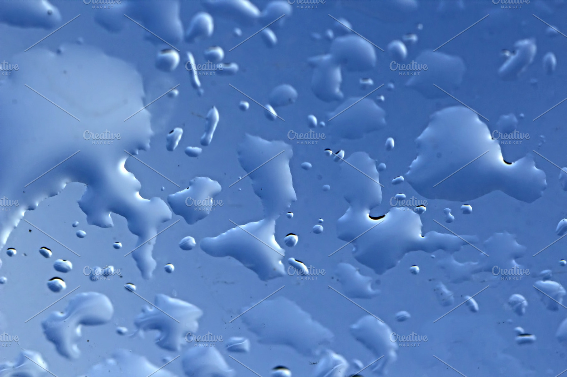 Fresh Water Drops On Blue Surface
