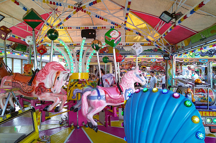 Bright carousel with colorful lights and horses, an Arts & Entertainment Photo by DanFLCreativo