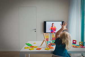Little girl learning at home containing online, video, and lesson