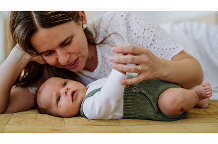 Portrait of mother cuddling her, a Person Photo by HalfPoint