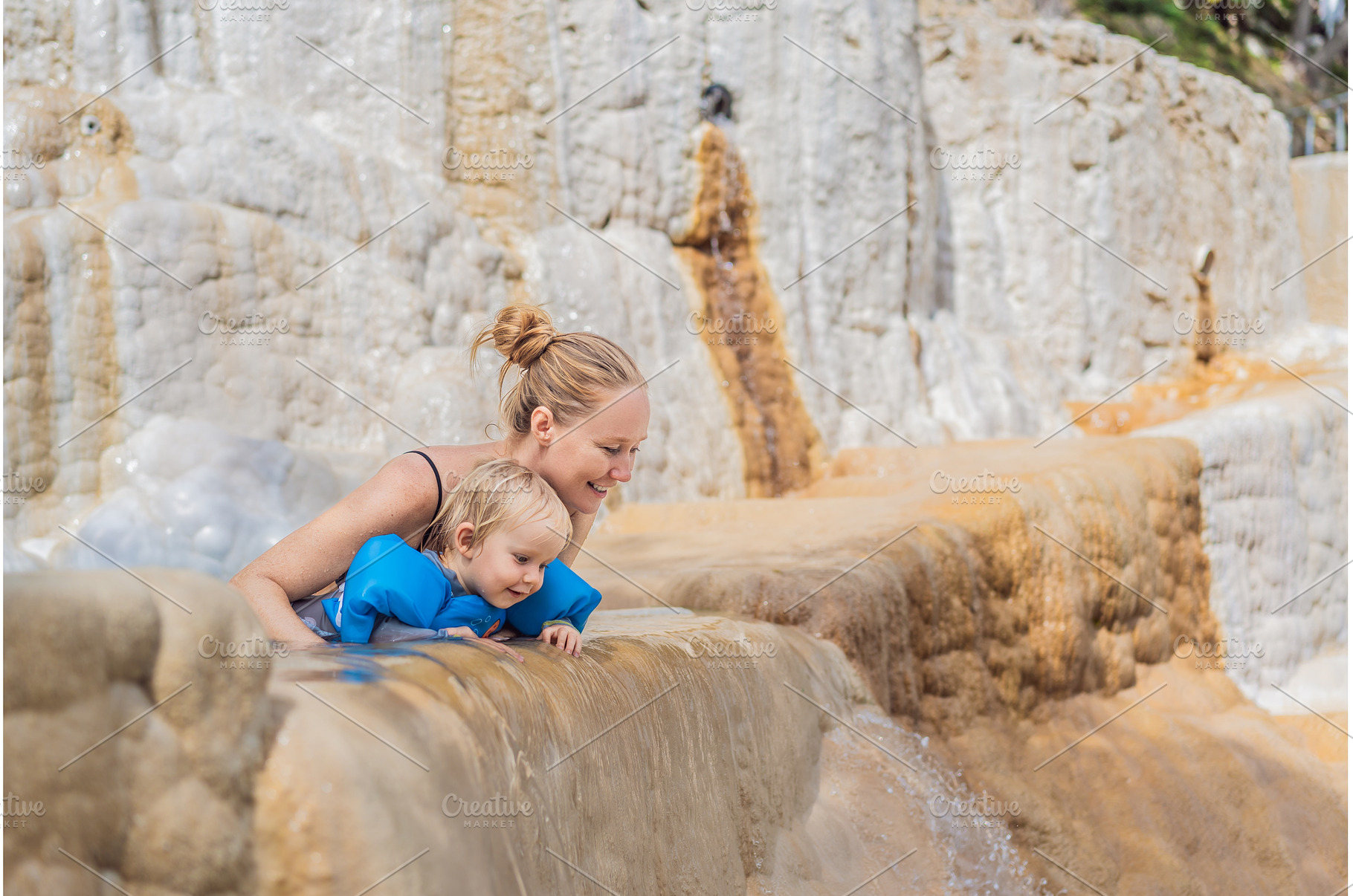 Mother and her toddler bathing in, a Nature Photo by Elizaveta Galitskaya