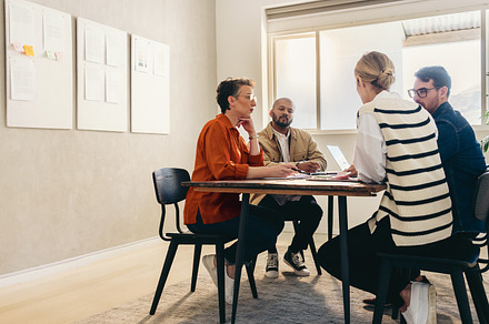Group of creative businesspeople brainstorming in an office