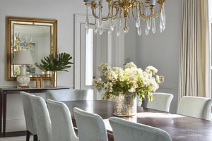 Elegant dining room interior with a large wooden table, light ch, a Photo by Studio ANNA