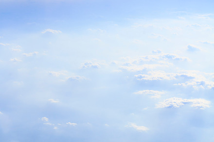 Blue sky and fluffy white clouds stock photo containing white clouds and