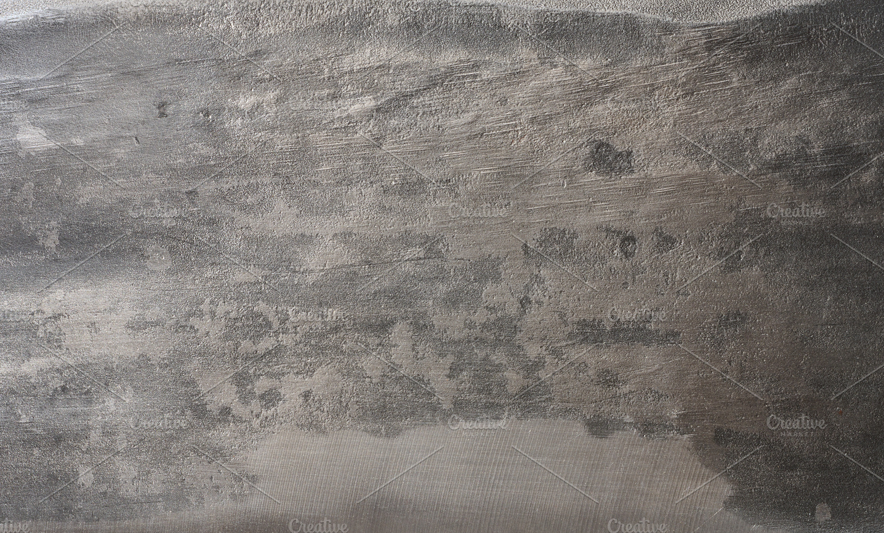 Worn and scratched metal surface with dark and light gray tones, a Background Photo by ndanko