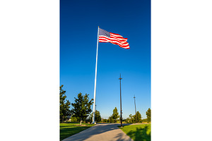 Large American flag at the, an Architecture Photo by Leonid Andronov