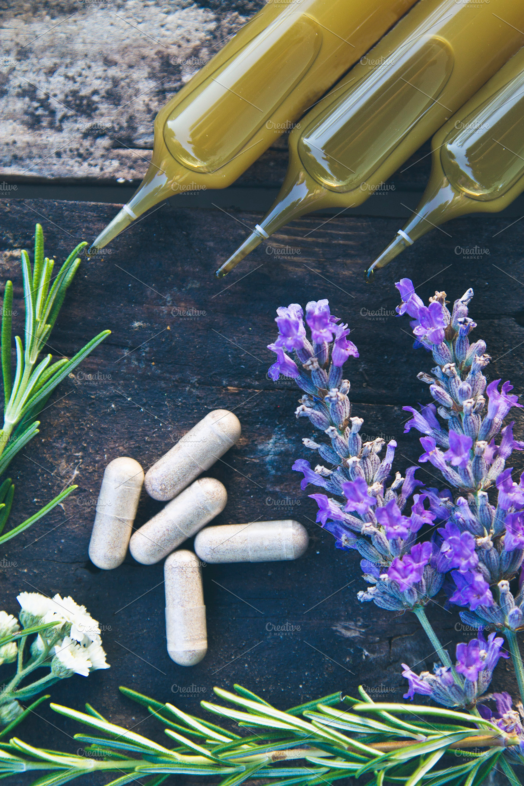 Natural medicine in ampules and pills on wooden background featuring medical, a Beauty & Fashion Photo by tetxu