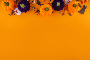 Happy Halloween holiday background with bright colorful pumpkins, a Holiday Photo by Rimma