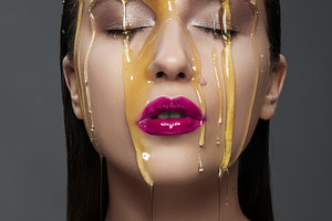woman with a honey on her face