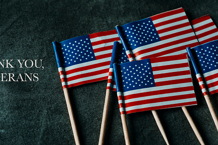 text thank you veterans and US flags, web banner, a Photo by Nito