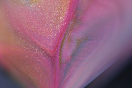 Sparkling paint fluid spill liquid flow texture