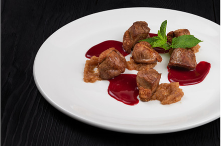 Pork meat with berries sauce, a Food & Drink Photo by Jan Jack Russo Media