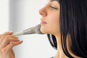 Applying makeup glamour cosmetic woman face brush, a Person Photo by Photo Drive Studio