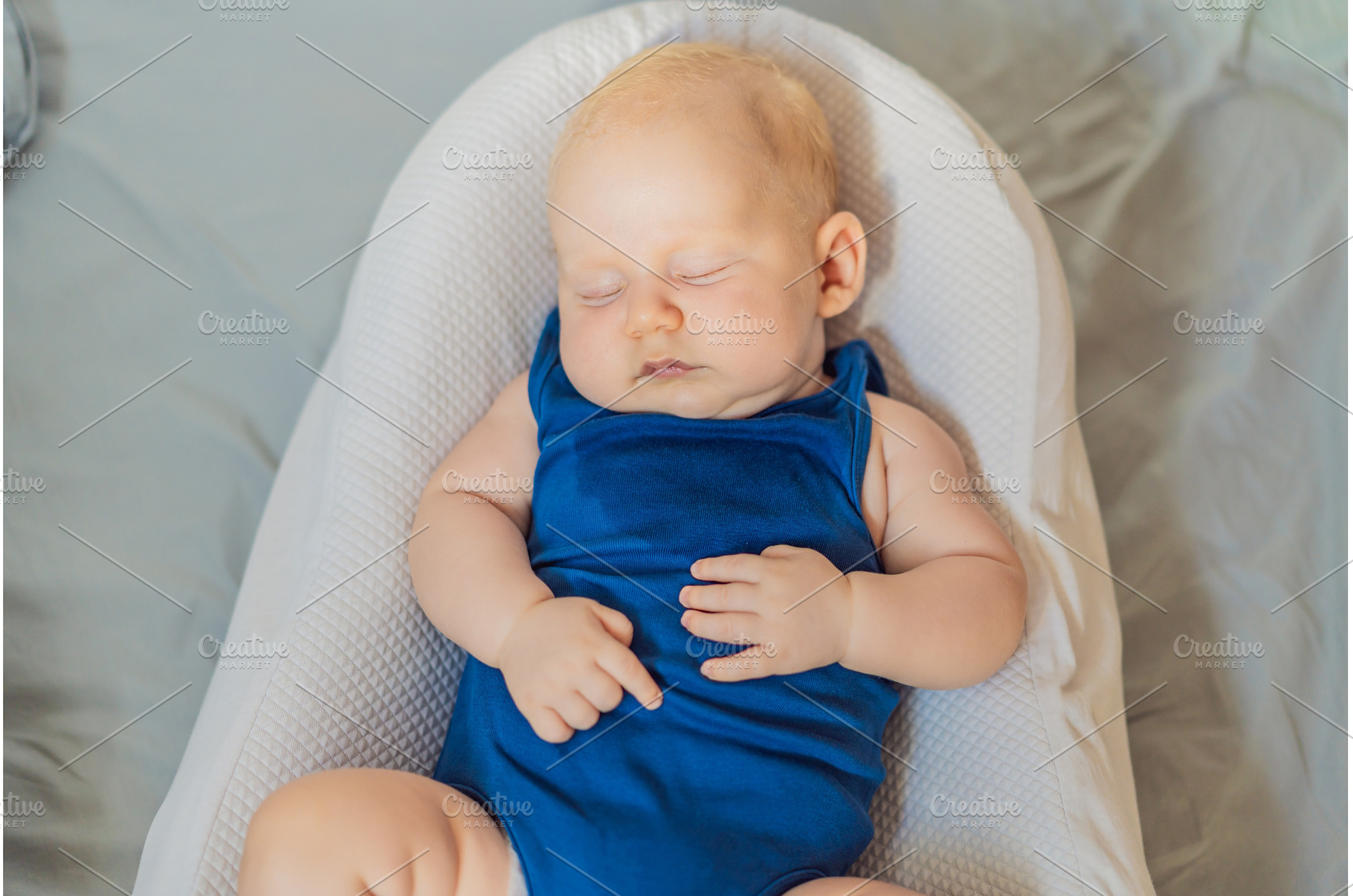 Chubby 3-month-old baby peacefully, a Person Photo by Elizaveta Galitskaya
