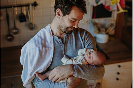 Close-up of father holding his, a Person Photo by HalfPoint