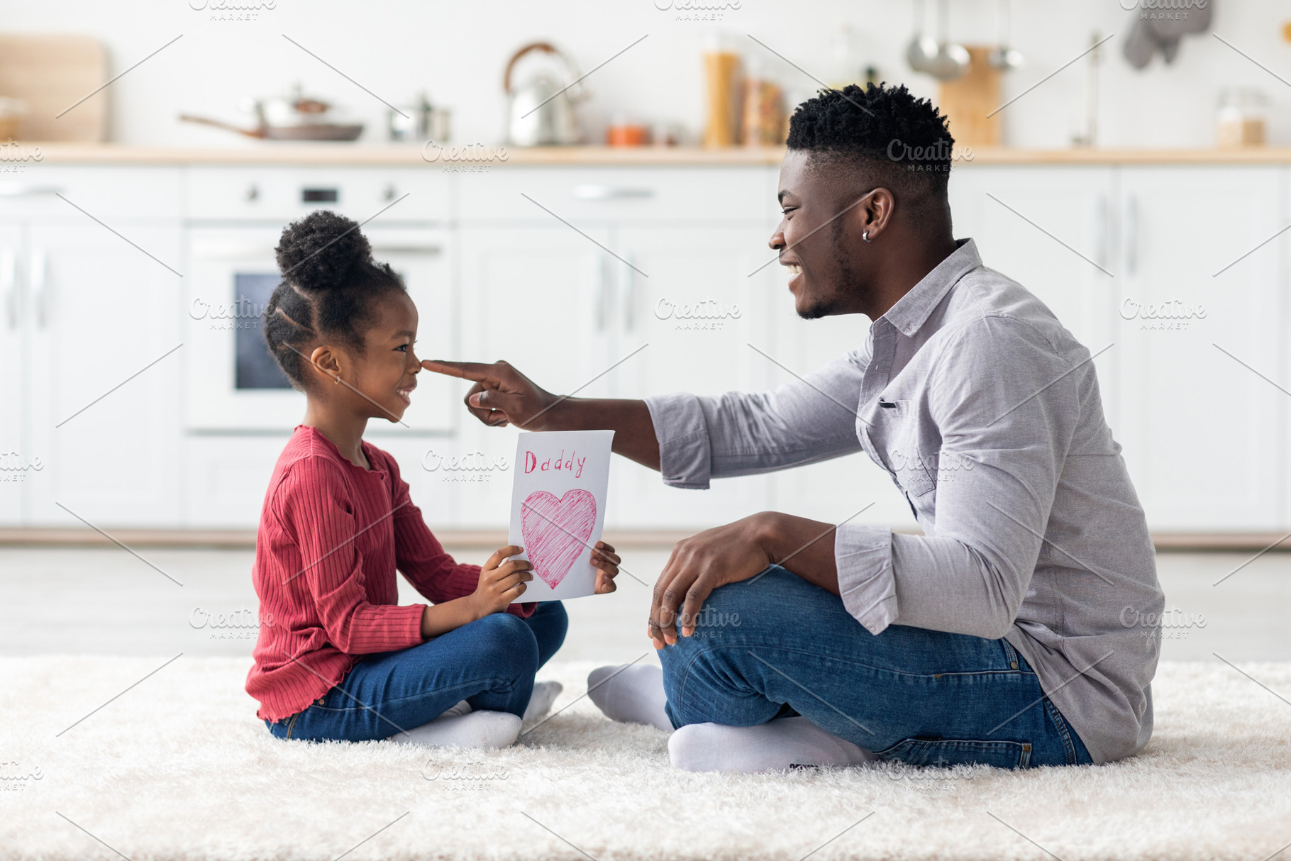 Cute little girl greeting her daddy with Fathers Day, a Photo by Prostock-Studio