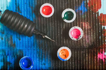 Tattoo artist table stock photo containing background and tattoo, a Technology Photo by BodiaPhoto