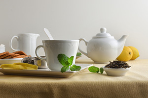 White ceramic tea set with ingredients and white isolated backgr, a Food & Drink Photo by Davizro's Market