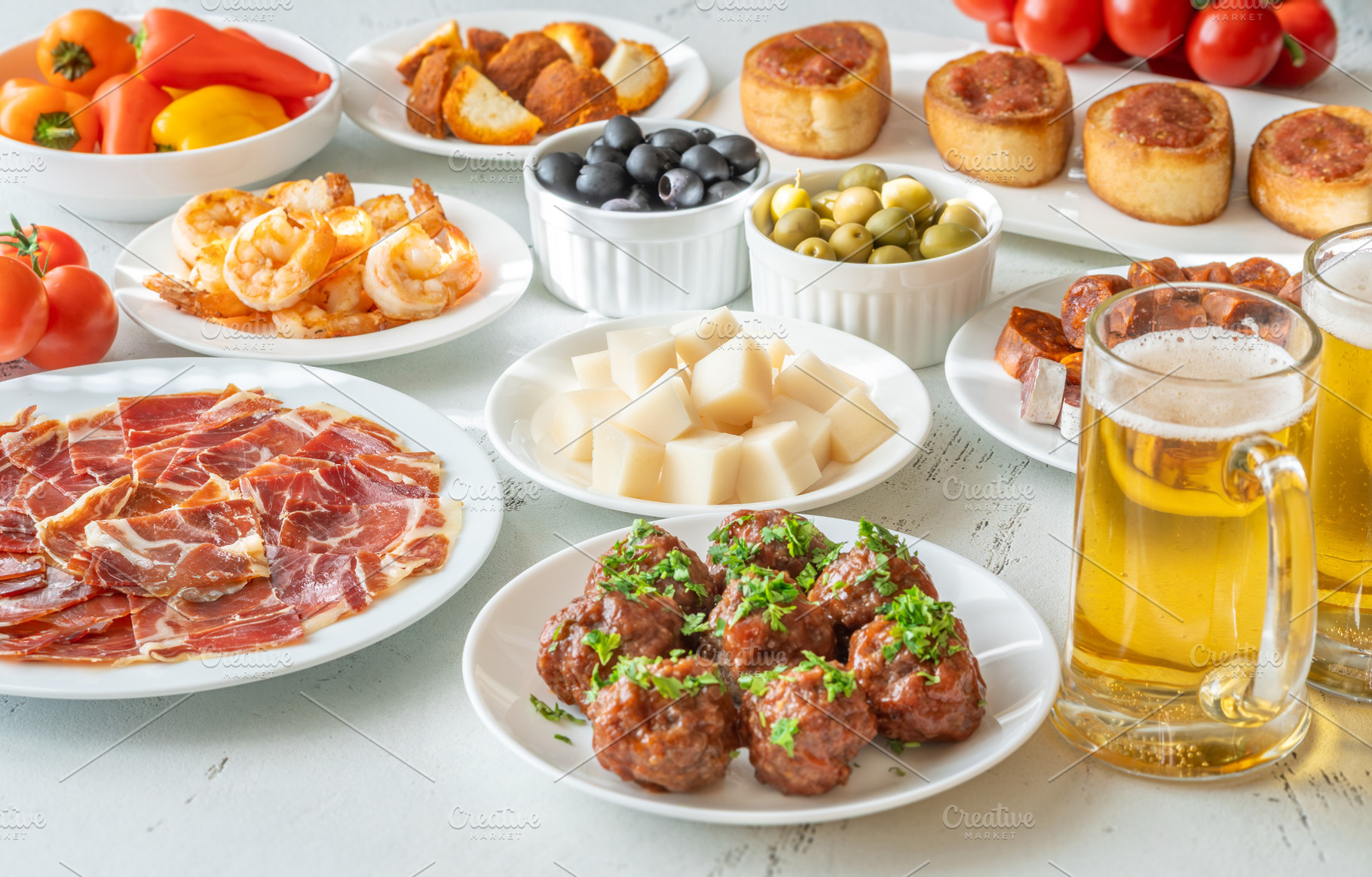 Spanish Tapas Spread with Jamon, Che, a Food & Drink Photo by Alexander Prokopenko