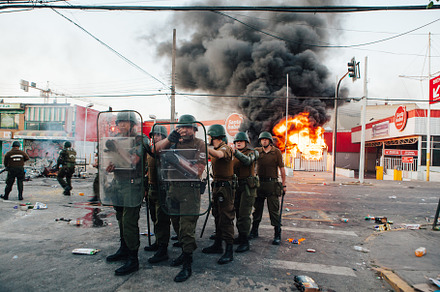 Protests in chile stock photo containing in a row and helmet
