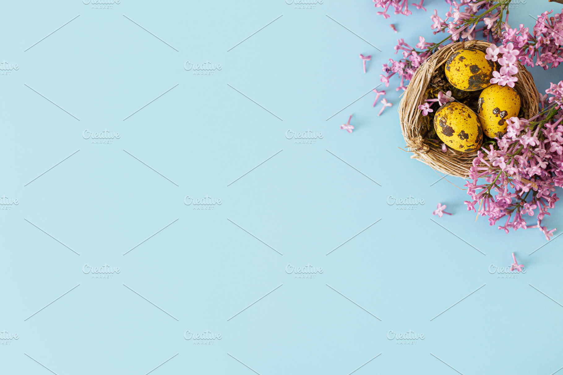 Easter flat lay. Stylish easter eggs in nest and lilac flowers o, a Holiday Photo by Sonjachni