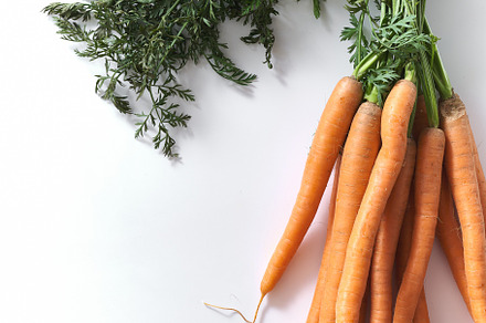 Flatlay with a bunch of fresh carrots with tops, a Food & Drink Photo by Asya Nurullina