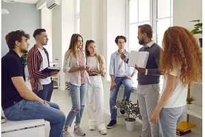 Group of students listening a, a Person Photo by StudioRomantic