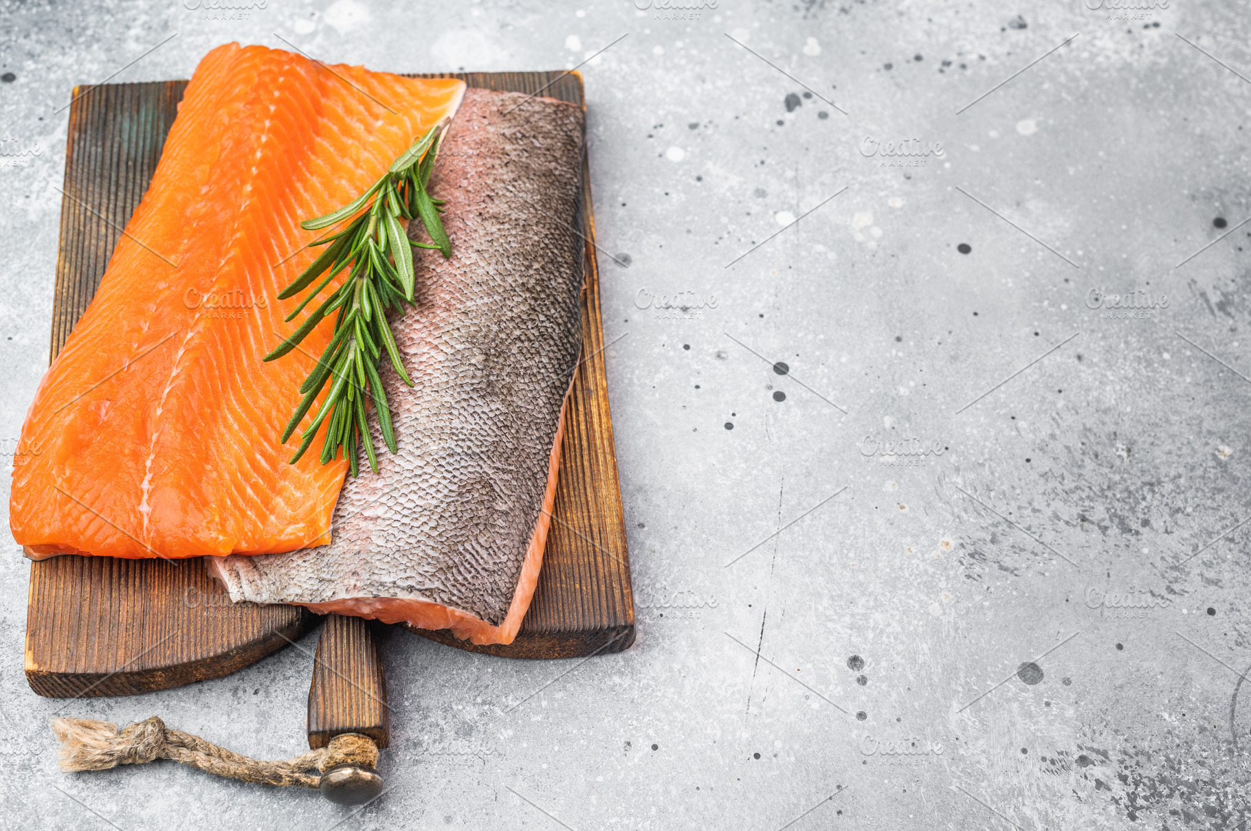 Fresh raw salmon fillet seafood ingredient with herbs and lemon, a Food & Drink Photo by composter-box@mail.ru