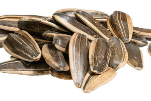 A pile of peeled sunflower seeds on isolated background, a Food & Drink Photo by ndanko