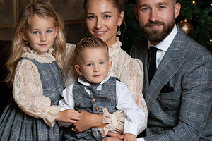 Happy family of four dressing in elegant formal clothing for Chr, a Person Photo by Studio ANNA