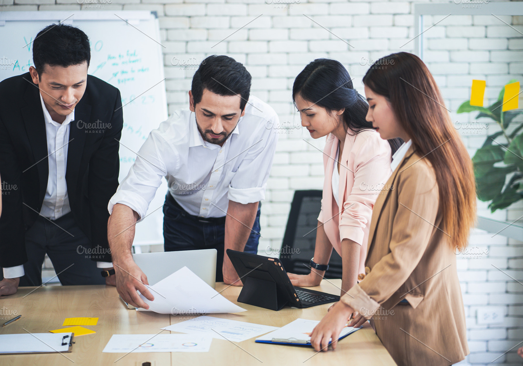 Successful business group working at the office, a Business Photo by Nednapa
