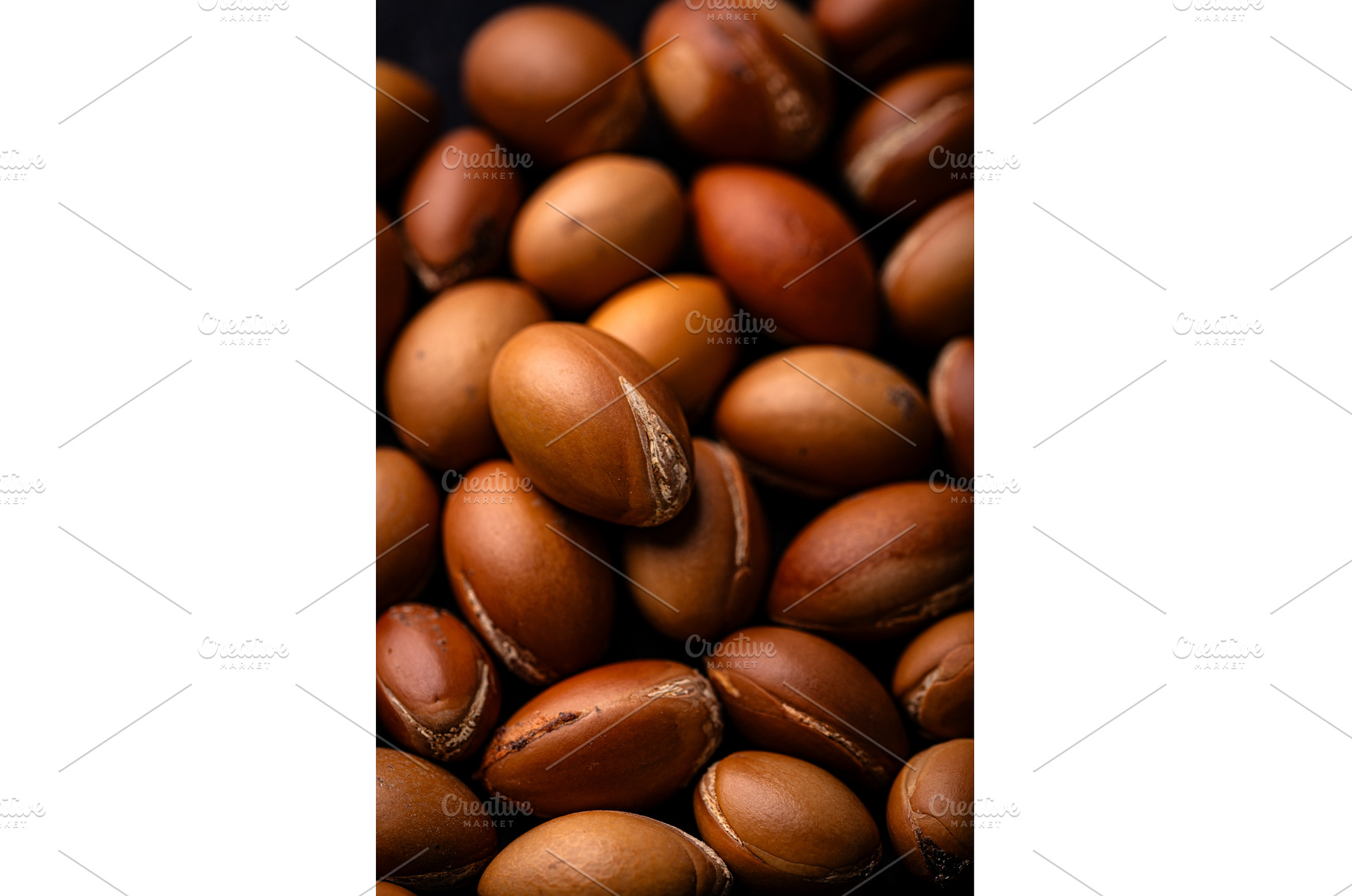 Pile of brown argan nuts texture, a Food & Drink Photo by Yulia Furman