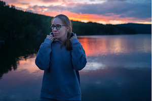 Woman sitting on the pier, a Person Photo by Jan Jack Russo Media