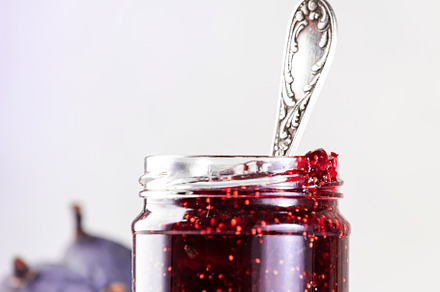 Fig confiture in glass jar. Fresh fruits on gray kitchen table,, a Food & Drink Photo by 5PH