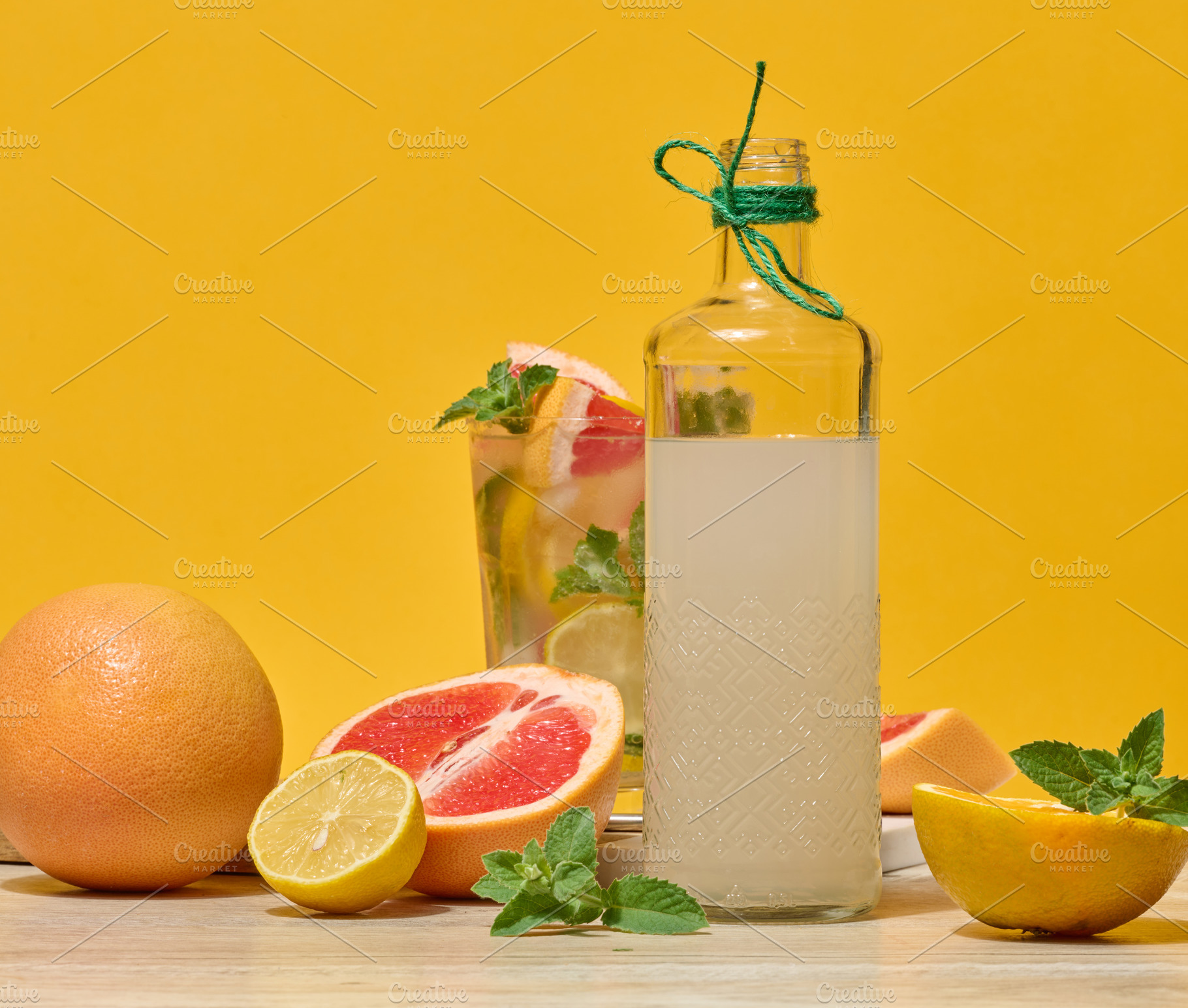 Glass bottle with homemade lemonade and a glass with a cold cock, a Food & Drink Photo by ndanko