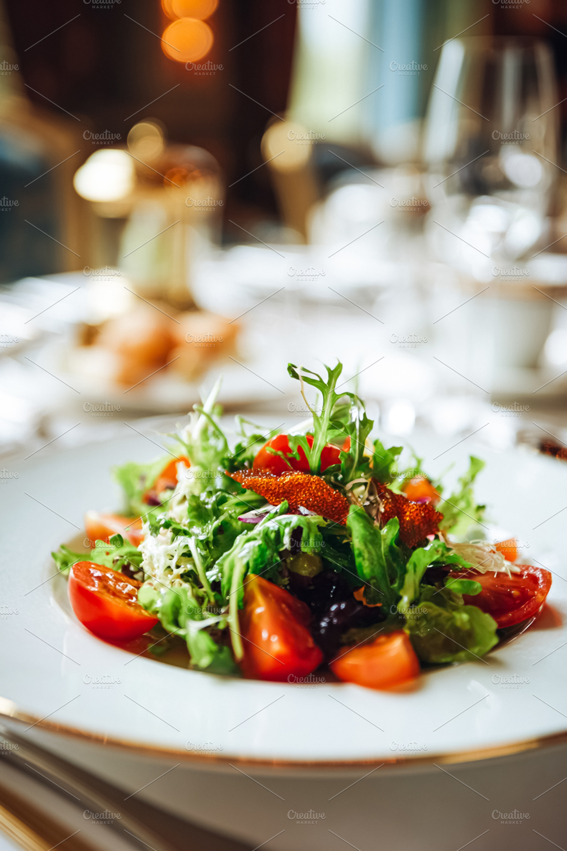 Gourmet salad with fresh vegetables and dried tomatoes served on, a Food & Drink Photo by Studio ANNA