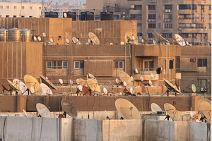 Many satellite dishes crowd the, an Architecture Photo by Backyard Stock
