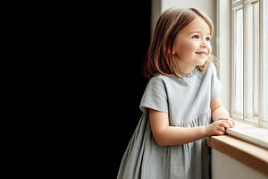 Smiling little girl standing by, a Person Photo by MistyDay