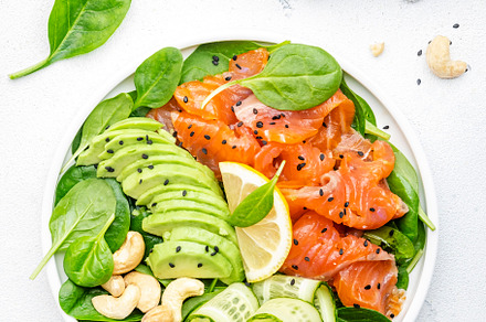 Salmon salad for ketogenic diet with avocado, spinach, cucumber,, a Food & Drink Photo by 5PH