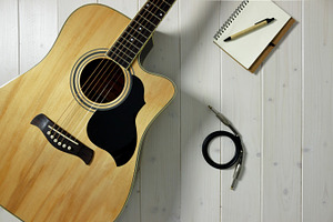 Acoustic guitar on wood top & cable featuring guitar, acoustic guitar, and